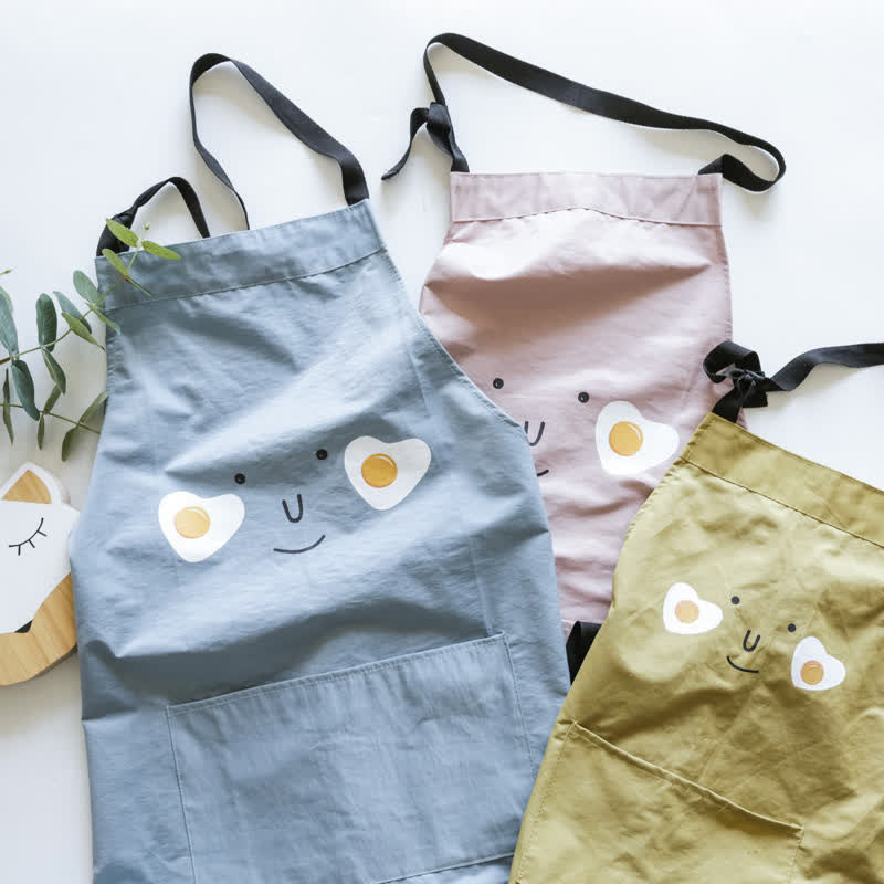 Sourire d'œuf au plat, tablier imperméable parent-enfant