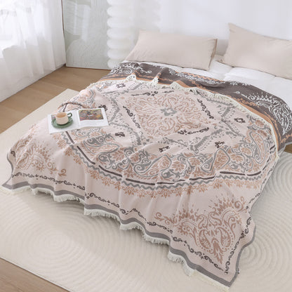 Couette légère en gaze de coton avec pompons et motif cachemire