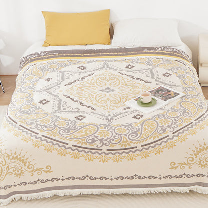 Couette légère en gaze de coton avec pompons et motif cachemire
