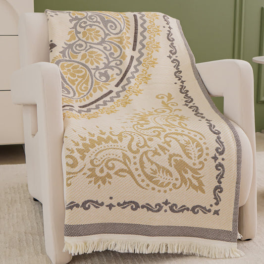 Couverture légère en gaze de coton avec pompons et motif cachemire