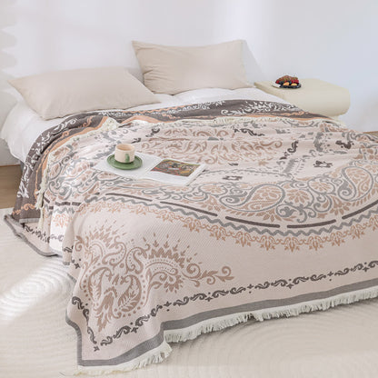Couette légère en gaze de coton avec pompons et motif cachemire
