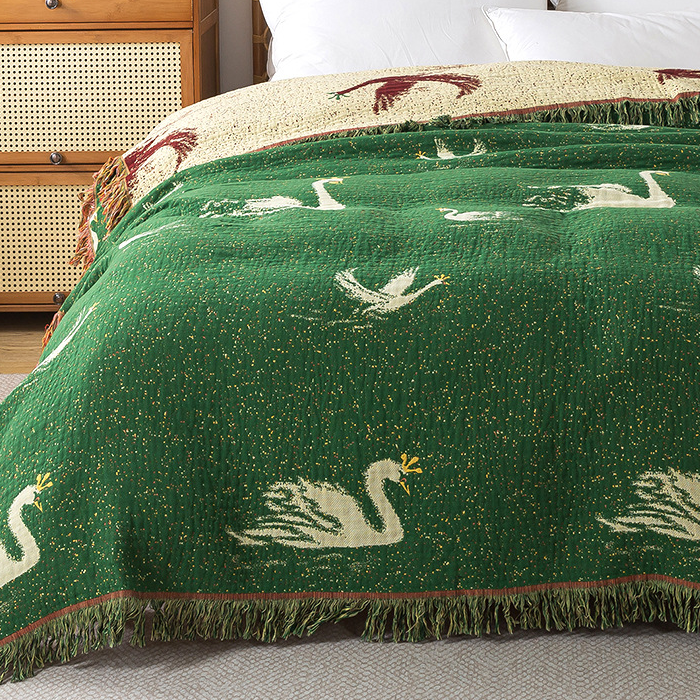 Élégante couette réversible en gaze de coton d'oie avec pompons