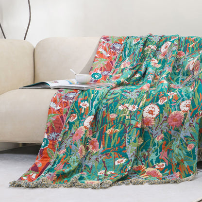 Couverture réversible en gaze de coton à motif floral et pompons