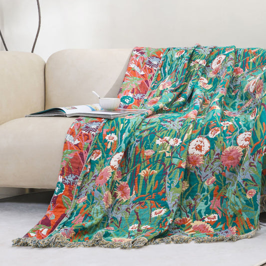 Couverture réversible en gaze de coton à motif floral et pompons