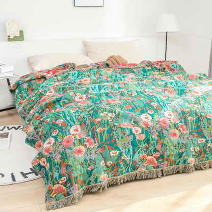 Couverture réversible en gaze de coton à motif floral et pompons