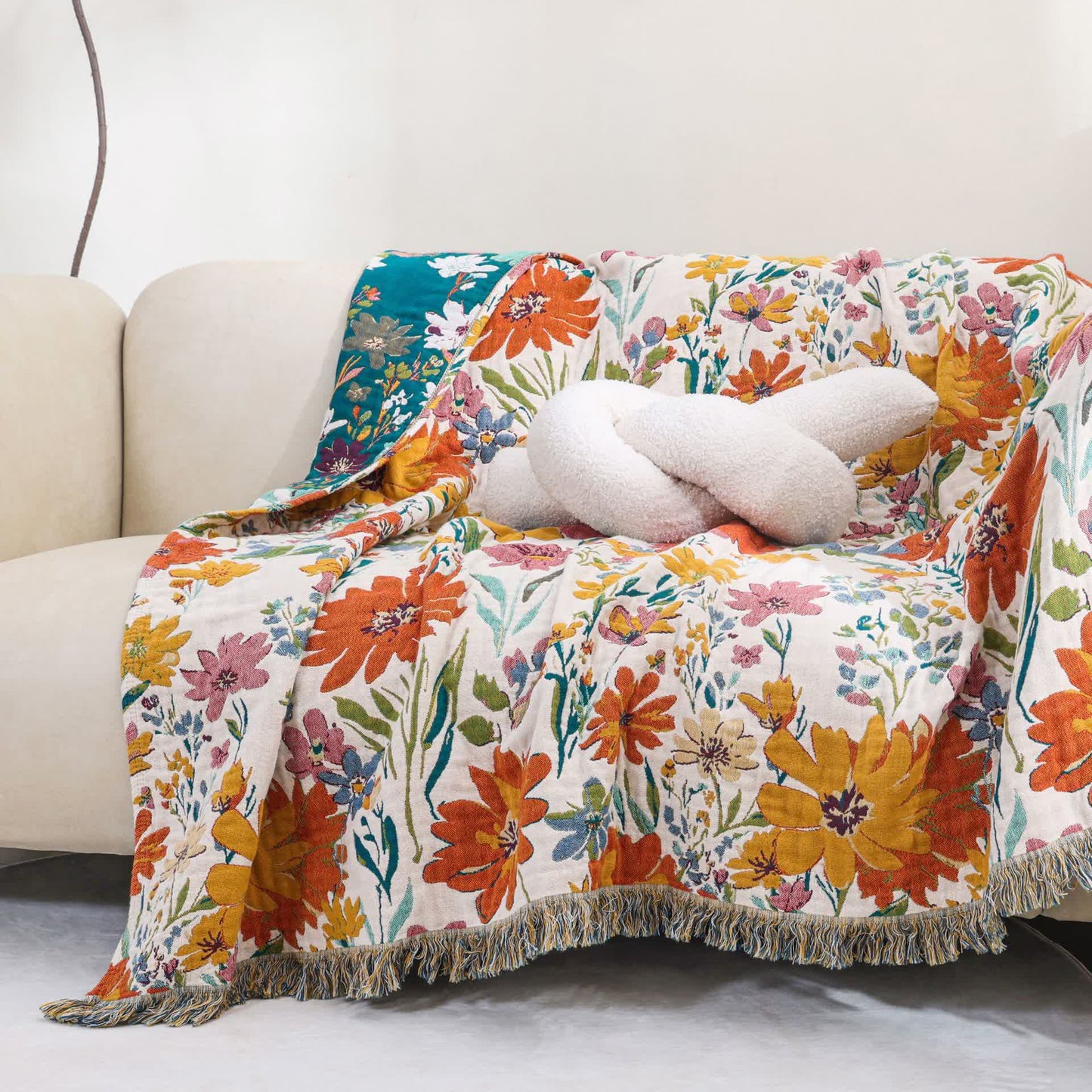 Couverture réversible en gaze de coton avec pompons et motif floral lumineux