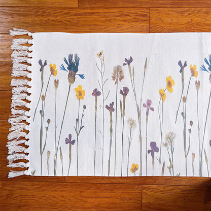Tapis de sol en coton et lin avec motif de branches de plantes et pompon