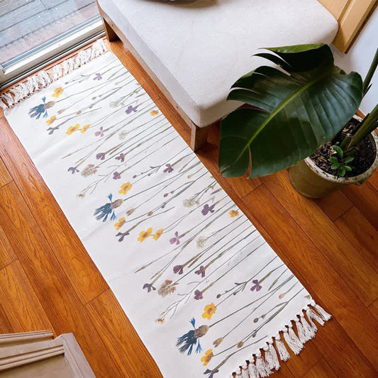 Tapis de sol en coton et lin avec motif de branches de plantes et pompon