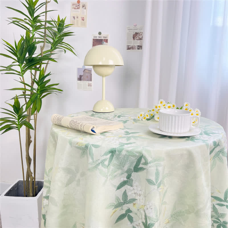 Nappe classique à pompons et motif floral en vert