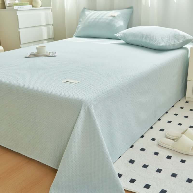 Couette en coton uni à structure gaufrée