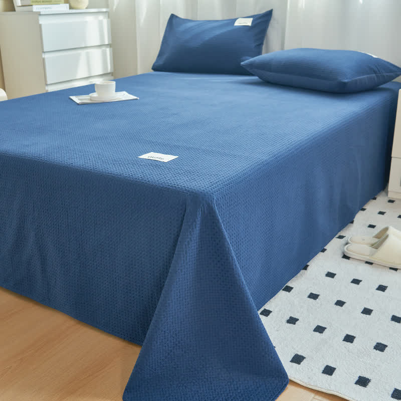 Couette en coton uni à structure gaufrée