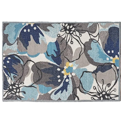 Tapis avec des feuilles et des fleurs tropicales