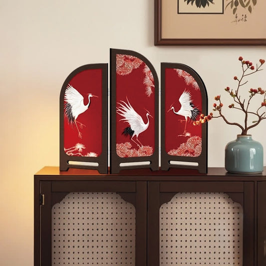 Paravent pliable avec grue à couronne rouge