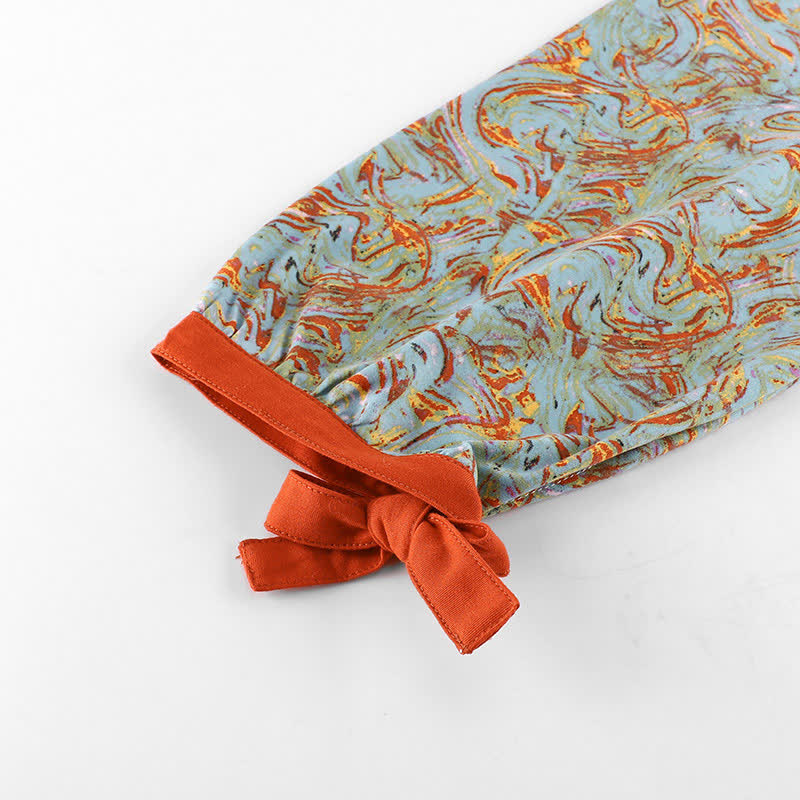 Ensemble de vêtements de détente orange et rouge avec imprimé à manches longues