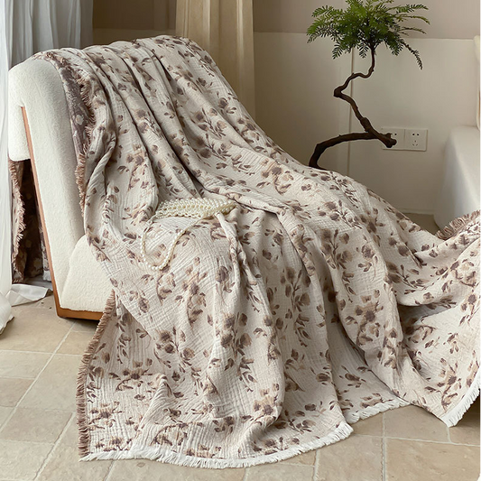 Couverture réversible en gaze de coton avec motif floral vintage et pompon