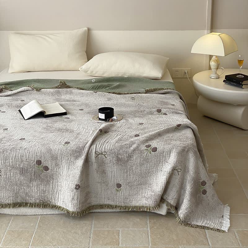 Couette réversible en gaze de coton teinte en fil avec pompons