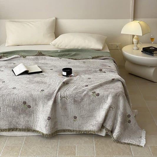 Couette réversible en gaze de coton teinte en fil avec pompons