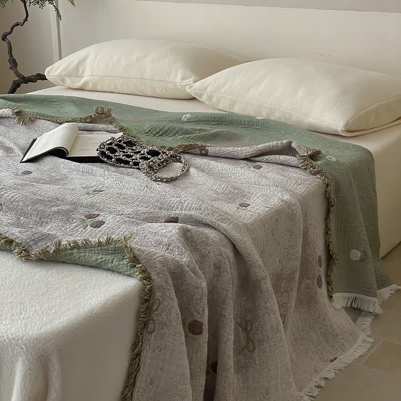 Couette réversible en gaze de coton teinte en fil avec pompons