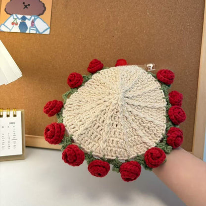 Dessous de verre crocheté fait main avec un bouquet de roses