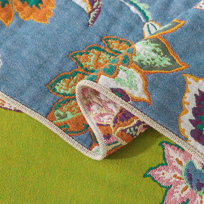 Couverture réversible colorée et florale en gaze de coton
