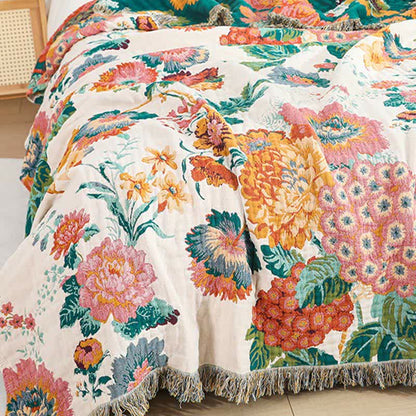 Couette réversible en gaze de coton multicouche avec motif floral et pompons