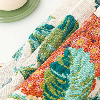 Couette réversible en gaze de coton multicouche avec motif floral et pompons