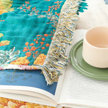Couette réversible en gaze de coton multicouche avec motif floral et pompons