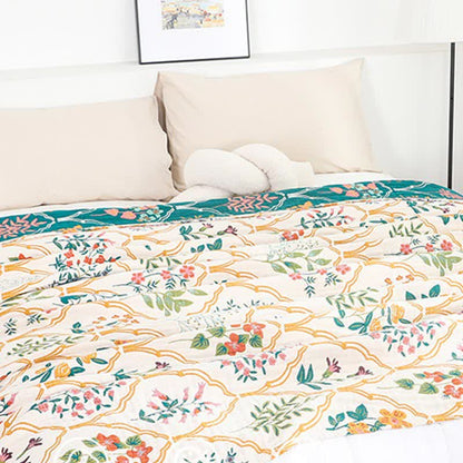 Couette réversible en gaze de coton à motif losanges et fleurs