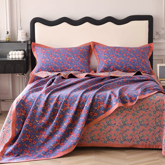 Couette réversible en gaze de coton à motif floral et jacquard