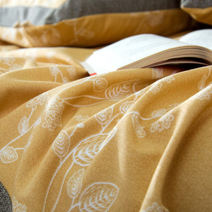 Couverture en coton avec un motif botanique lumineux