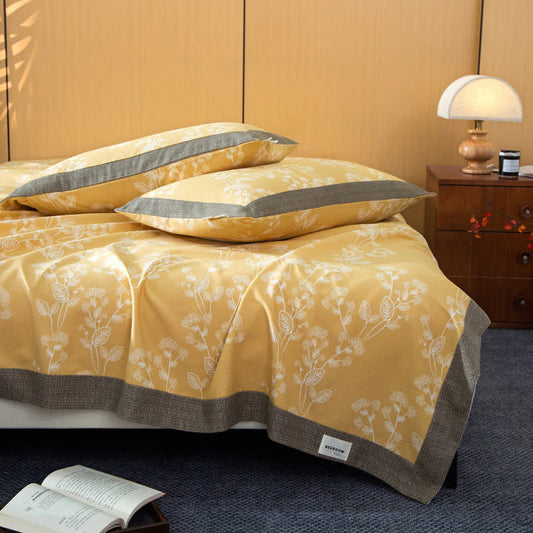 Couverture en coton avec un motif botanique lumineux