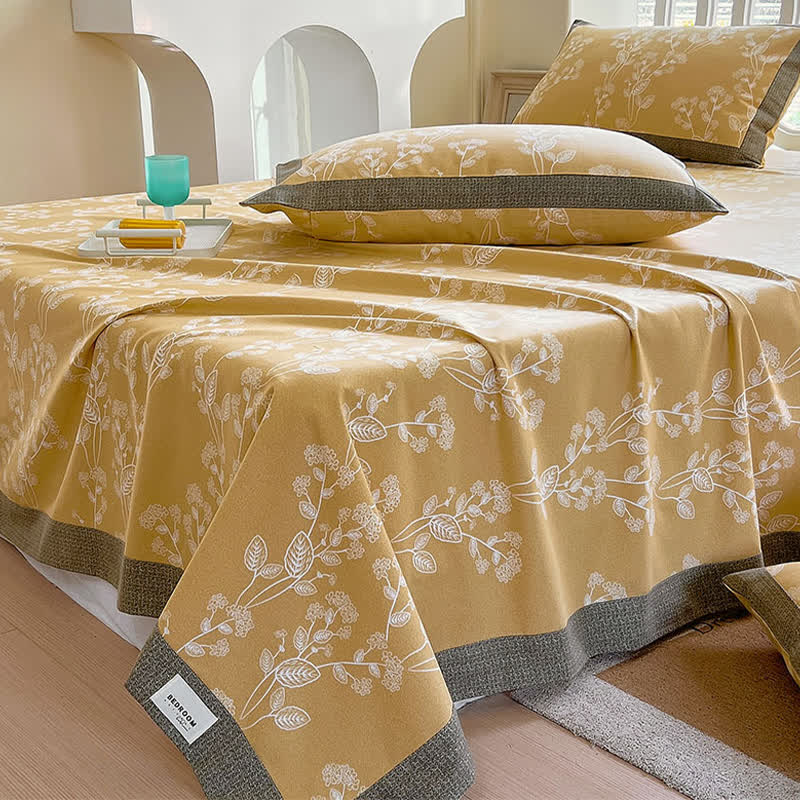Couverture en coton avec un motif botanique lumineux