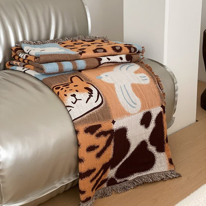 Couette en gaze de coton à quatre couches avec pompons et imprimé animalier
