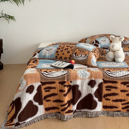 Couette en gaze de coton à quatre couches avec pompons et imprimé animalier