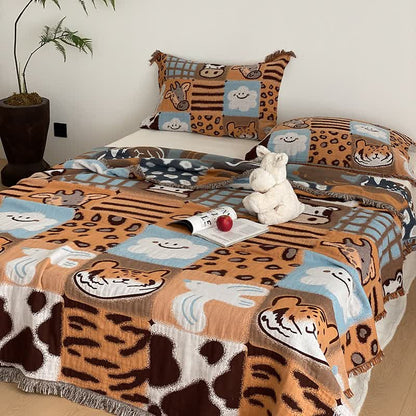 Couette en gaze de coton à quatre couches avec pompons et imprimé animalier
