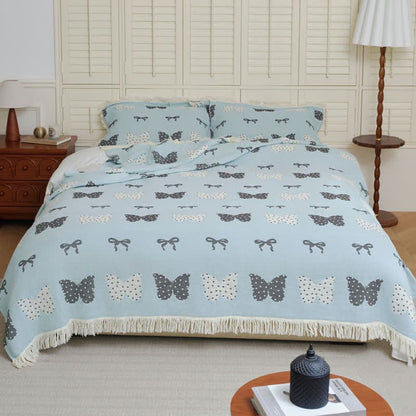 Couette douce en gaze de coton pur avec nœud papillon et pompon
