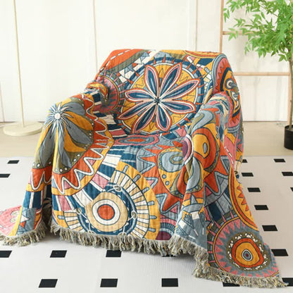 Couette réversible en gaze de coton avec motif floral artistique et pompons