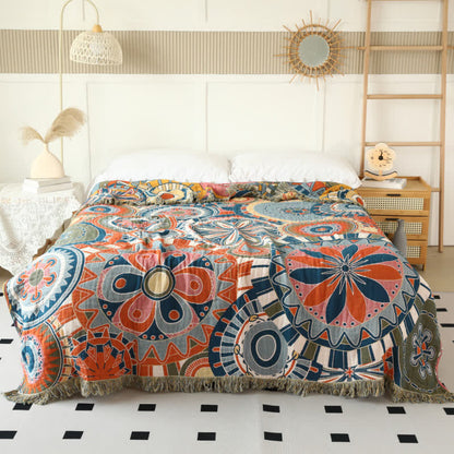 Couette réversible en gaze de coton avec motif floral artistique et pompons