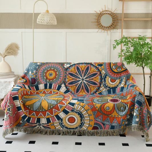 Couverture réversible en gaze de coton avec motif floral artistique et pompons