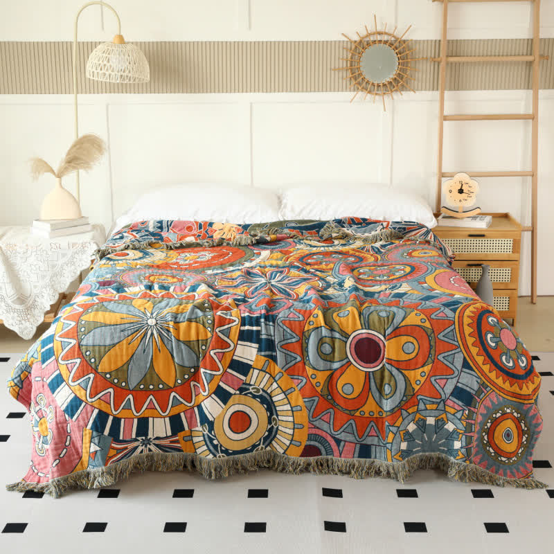 Couette réversible en gaze de coton avec motif floral artistique et pompons