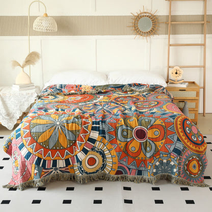 Couette réversible en gaze de coton avec motif floral artistique et pompons