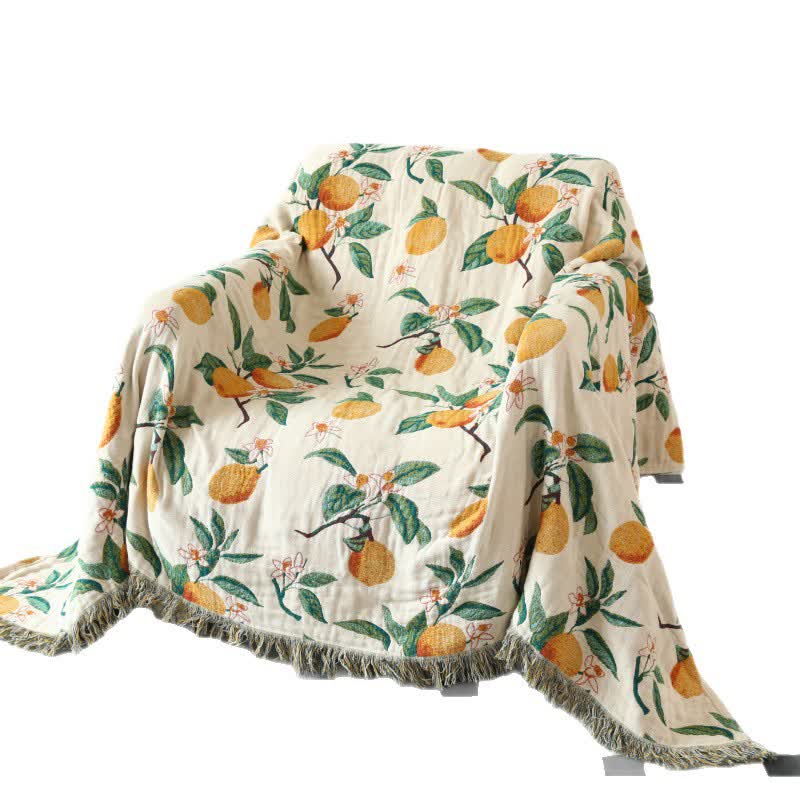 Couverture réversible en gaze de coton avec pompons et imprimé citron