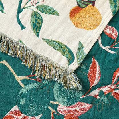 Couverture réversible en gaze de coton avec pompons et imprimé citron