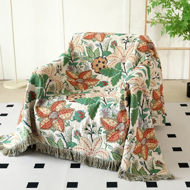 Couette réversible en gaze de coton avec motif floral et feuilles et pompons