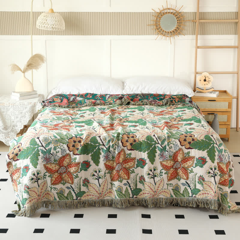 Couette réversible en gaze de coton avec motif floral et feuilles et pompons