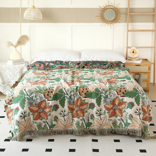 Couette réversible en gaze de coton avec motif floral et feuilles et pompons