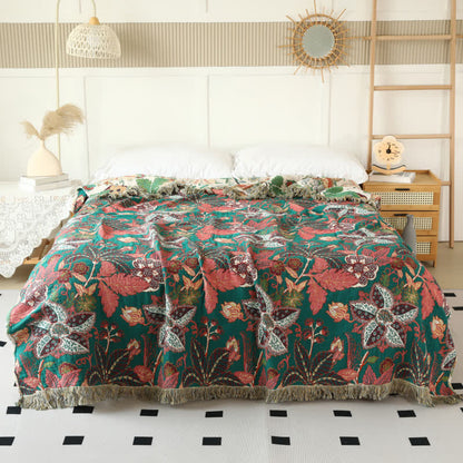 Couette réversible en gaze de coton avec motif floral et feuilles et pompons
