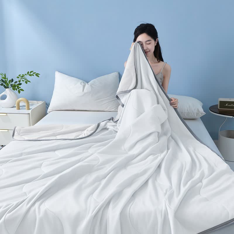Couette rafraîchissante à structure ondulée unie