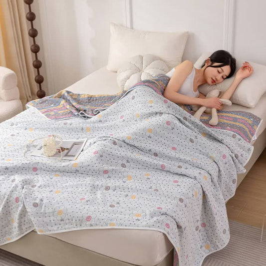 Couette réversible en coton à motif floral et à pois