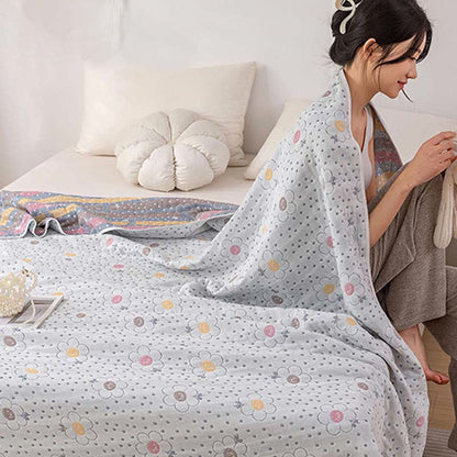 Couette réversible en coton à motif floral et à pois